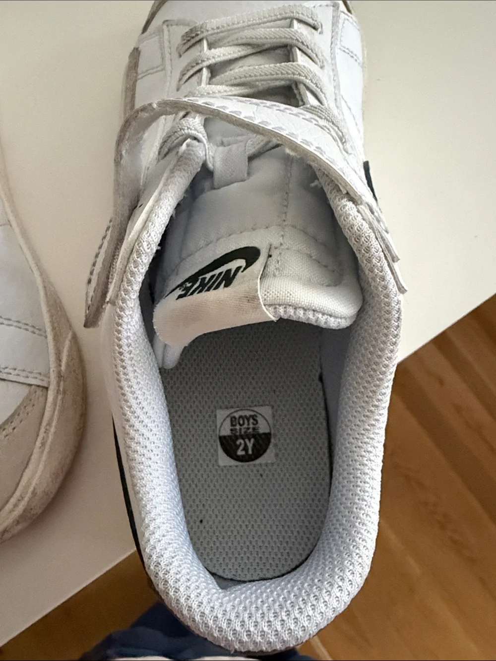 Nike Kids White Sneakers with Dark Green Swoosh